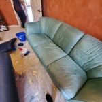 Photo of leather Natuzzi couch before restoration