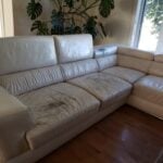 Picture of worn and scratched white leather sectional