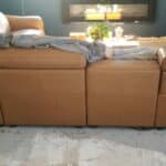 Picture of back of scuffed aniline leather sectional restored with mix of RubnRestore colors