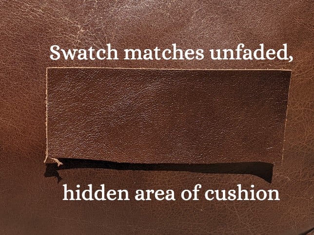 Picture of swatch of leather on top of unfaded area of matching couch cushion