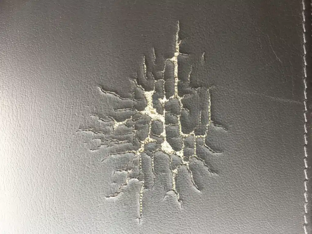Picture of curling edges and spider web pattern when vinyl cracks