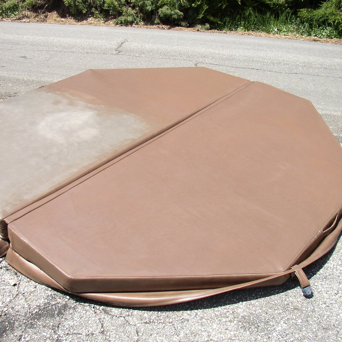 Picture of dry, sun faded hot tub cover 3/4 refinished and protected with custom brown Rub n Restore vinyl paint