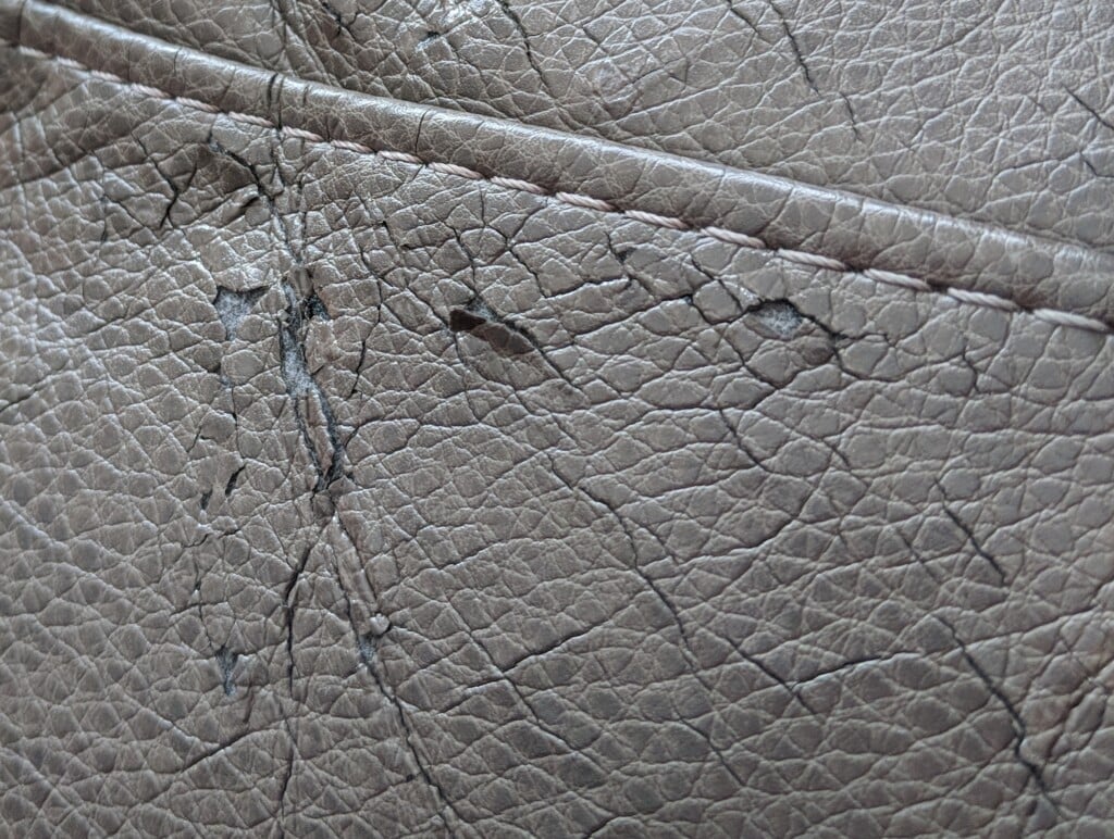 Close-up showing hairline cracks in polyurethane faux leather