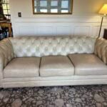Worn ivory leather couch