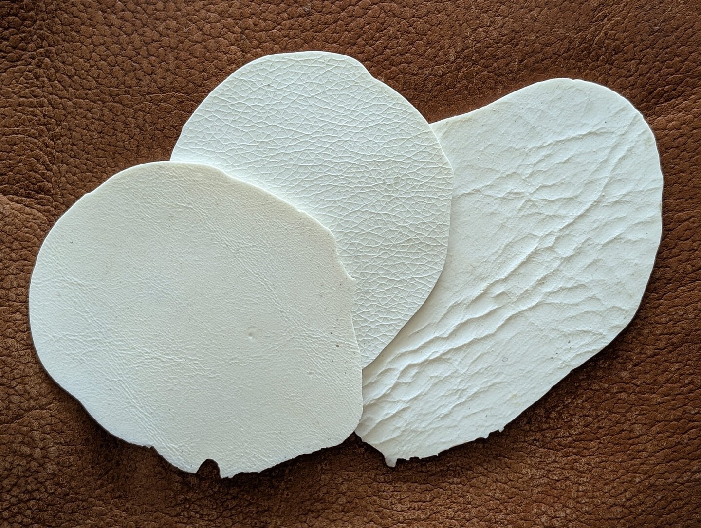 Picture of silicone grain pads showing texture used to emboss vinyl during repair process with plastisol heat-cure putty