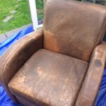 Dirty leather club chair before restoration