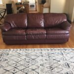 Picture of reddish brown leather couch before restoration