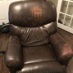 Picture of discoloration and fading on head and arm on brown leather recliner chair