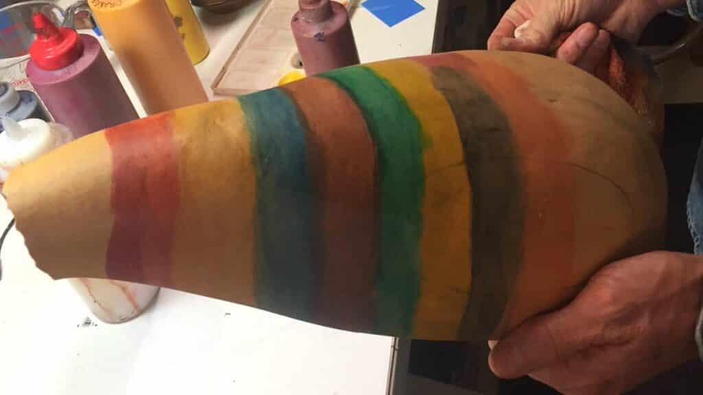 Picture of gourd with test patches of leather paint