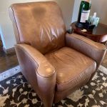 Picture of leather chair with oil stain and tear