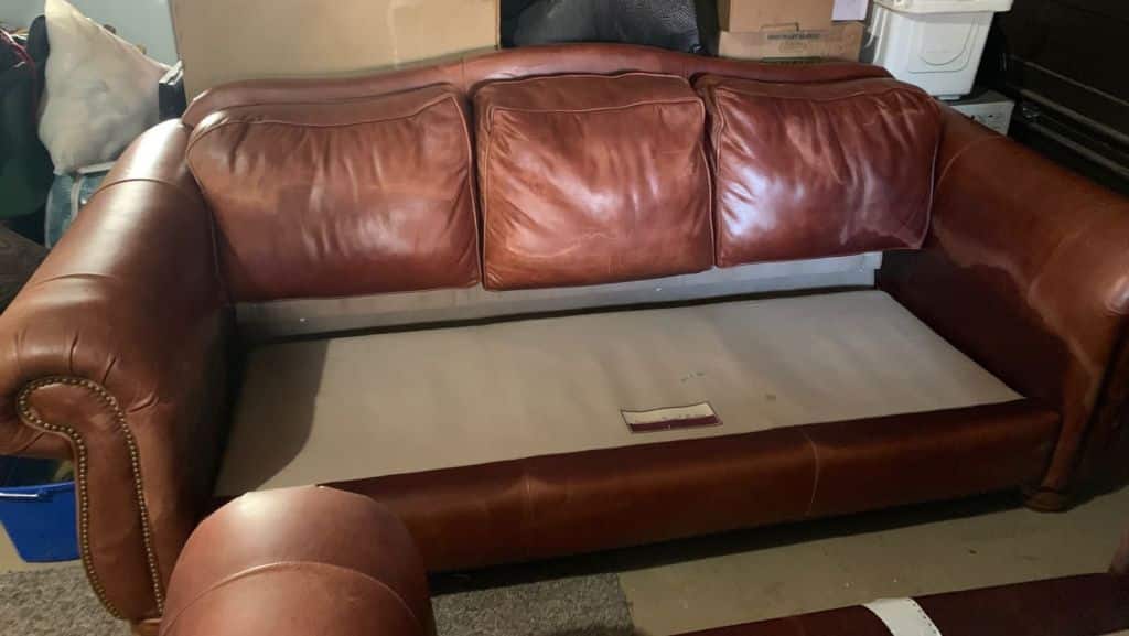 Picture of leather sofa damaged by mineral deposits after cleaning