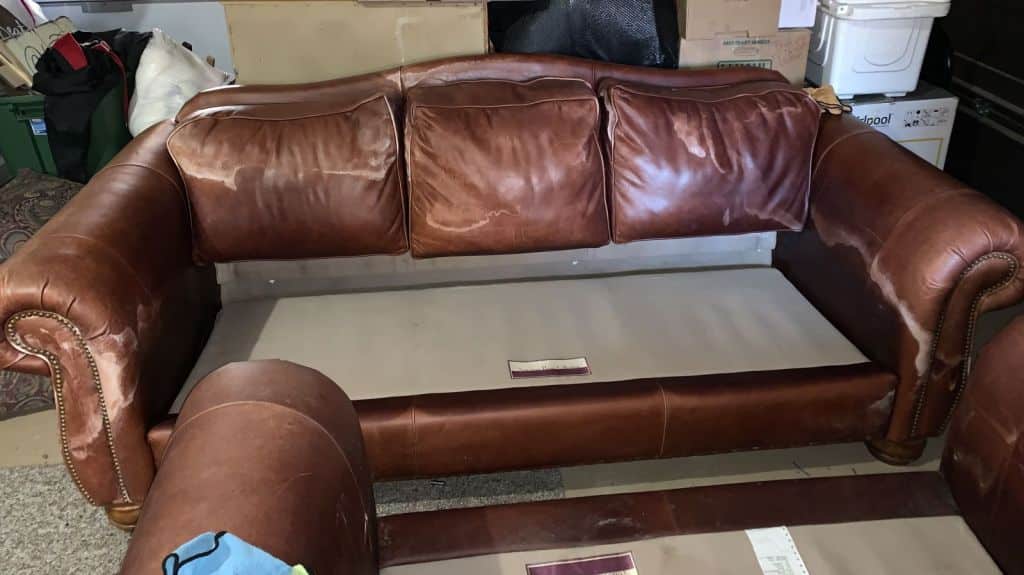 Picture of leather couch damaged by mineral deposits